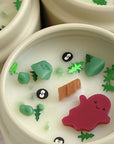 Creepy Campsite Halloween Candle with scents of grass, earth, and moss