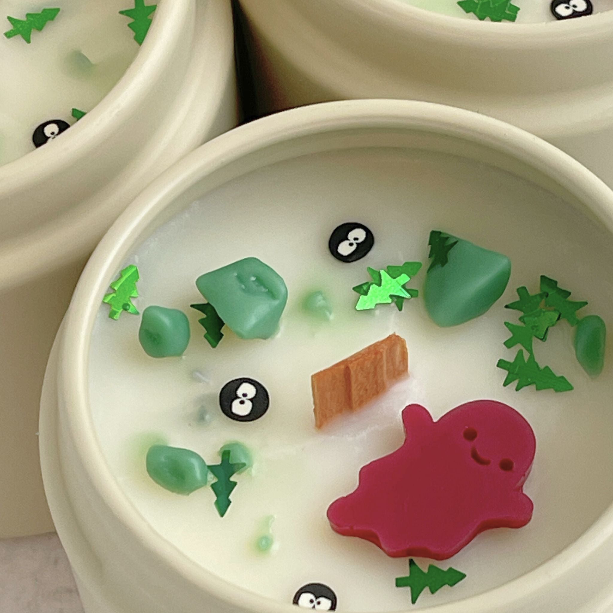 Creepy Campsite Halloween Candle with scents of grass, earth, and moss