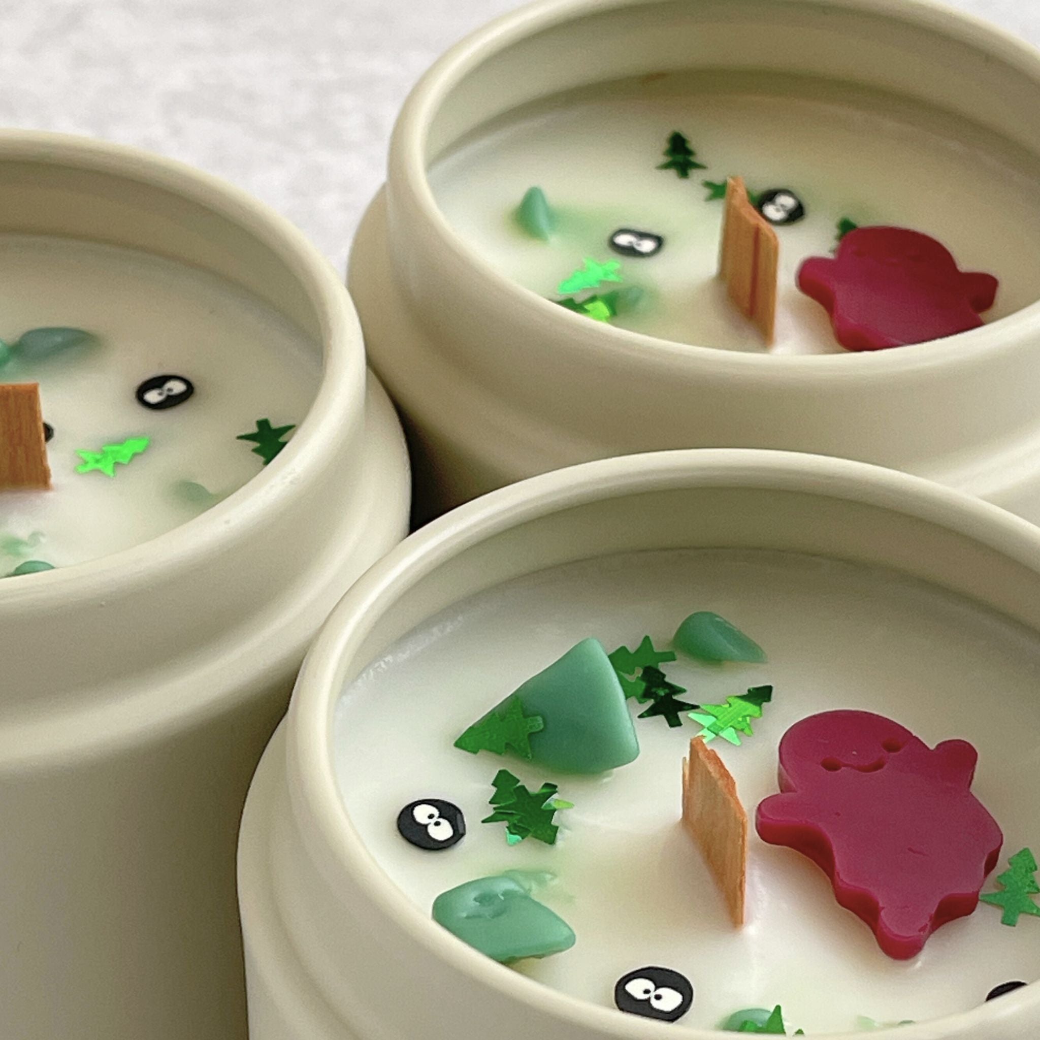 Creepy Campsite Halloween Candle with scents of grass, earth, and moss