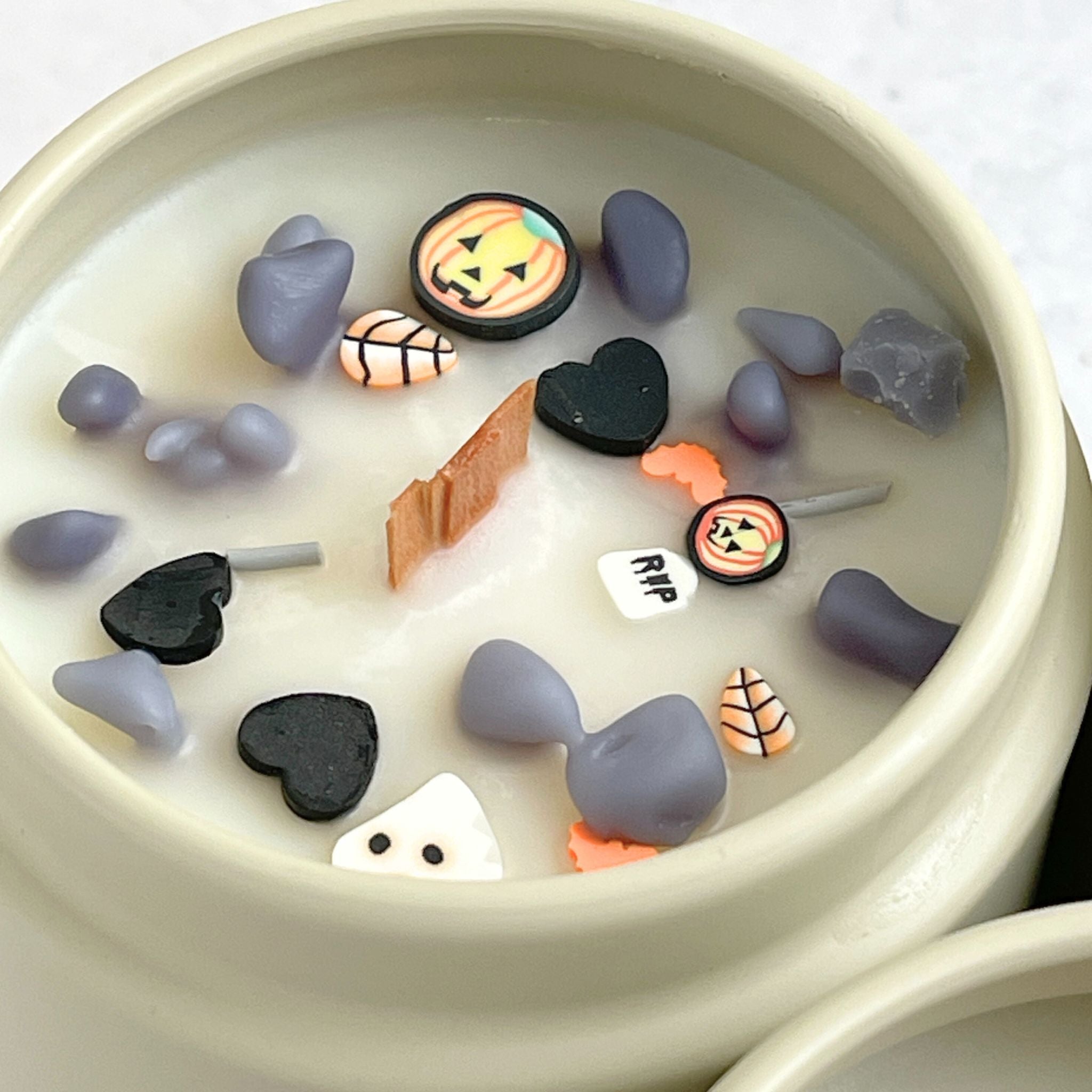 Spooky Vibes Halloween Candle with scents of dried herbs, leather, and charred wood